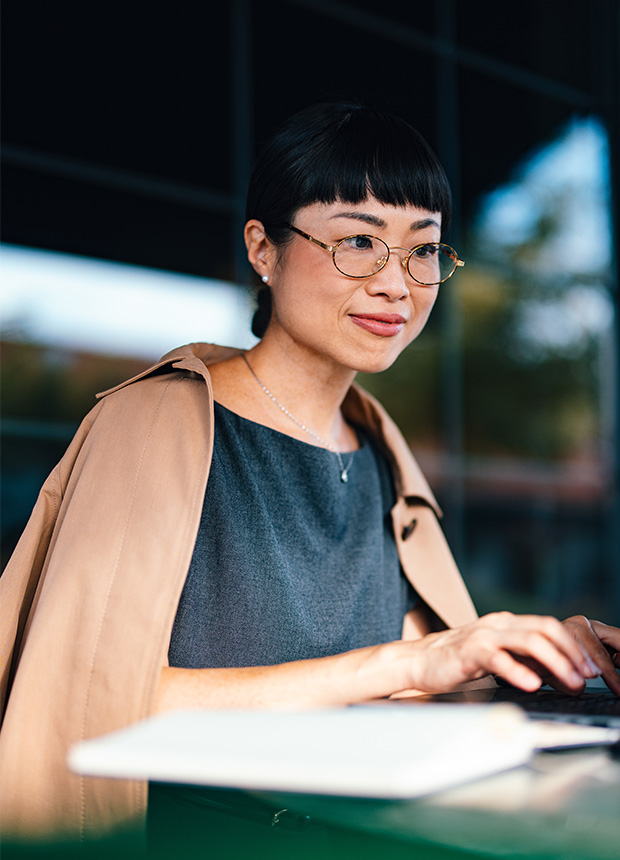 Woman working on a laptop in a co-working space
